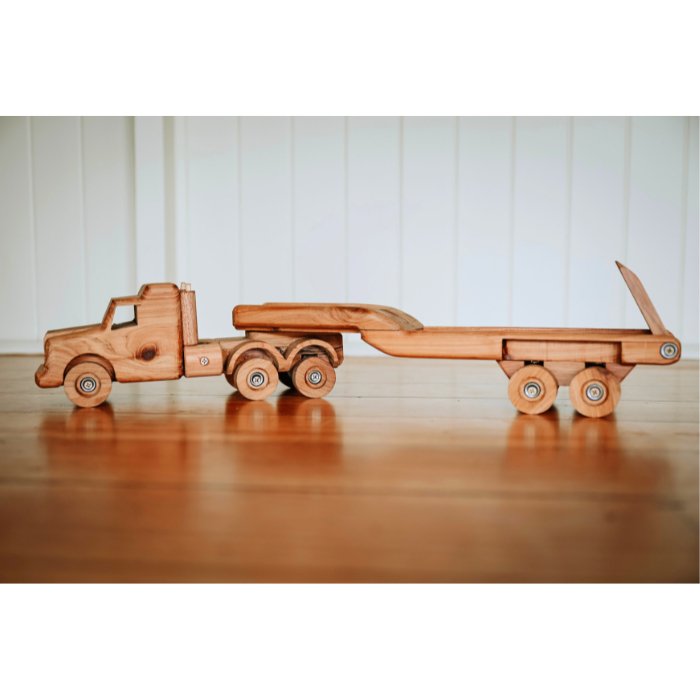 Large handmade wooden low loader truck and float toy. Luxurious and Premium design, quality craftmanship and materials. Showcasing Removable float trailer, suspension and functional ramps. 