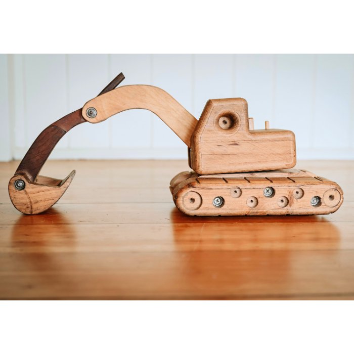 Ballard Bear Premium Handmade Wooden Excavator Toy with extended arm and bucket. Rotating cab and quality craftmanship details. Rolling wheels beneath tracks. 