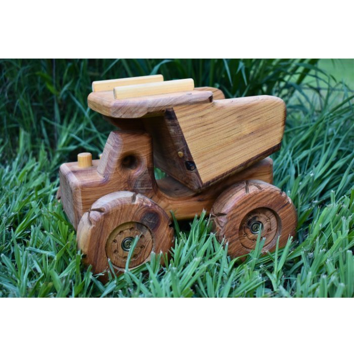 Ballard Bear Qualtiy Durable handmade wooden dump truck resembling a mining haul pac. Showcasing huge tyres with chunky tread and workable dump body tip tray. 